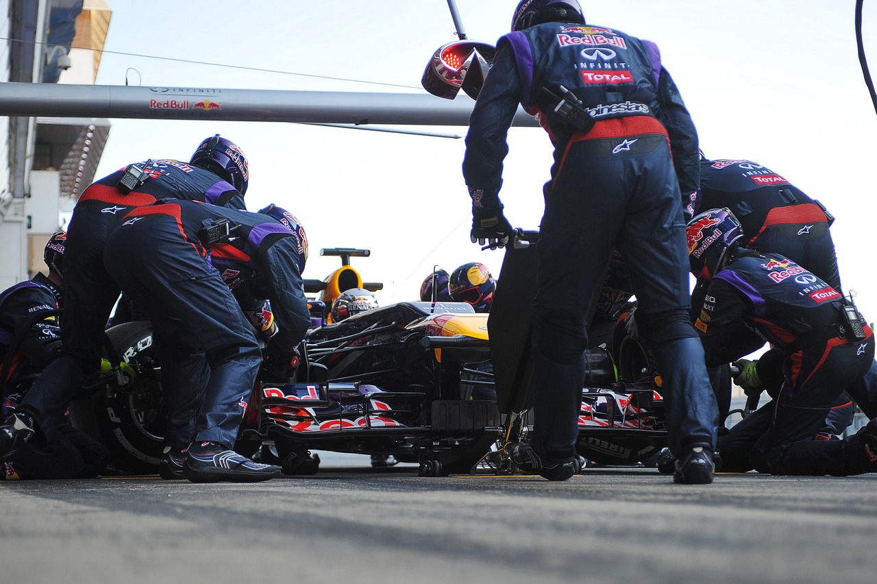 Sebastian Vettel (GER) Red Bull Racing RB9 practices a pit stop.
