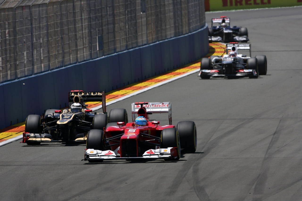 24.06.2012- Race, Kimi Raikkonen (FIN) Lotus F1 Team E20 and Fernando Alonso (ESP) Scuderia Ferrari F2012 