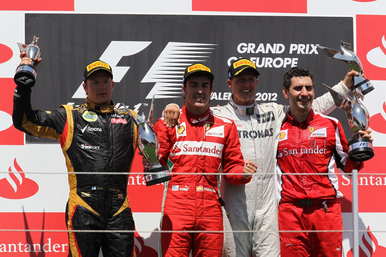 24.06.2012- Race, Fernando Alonso (ESP) Scuderia Ferrari F2012 race winner, 2nd position Kimi Raikkonen (FIN) Lotus F1 Team E20 and 3rd position Michael Schumacher (GER) Mercedes AMG F1 W03 with Andrea Stella (ITA) Ferrari Race Engineer 