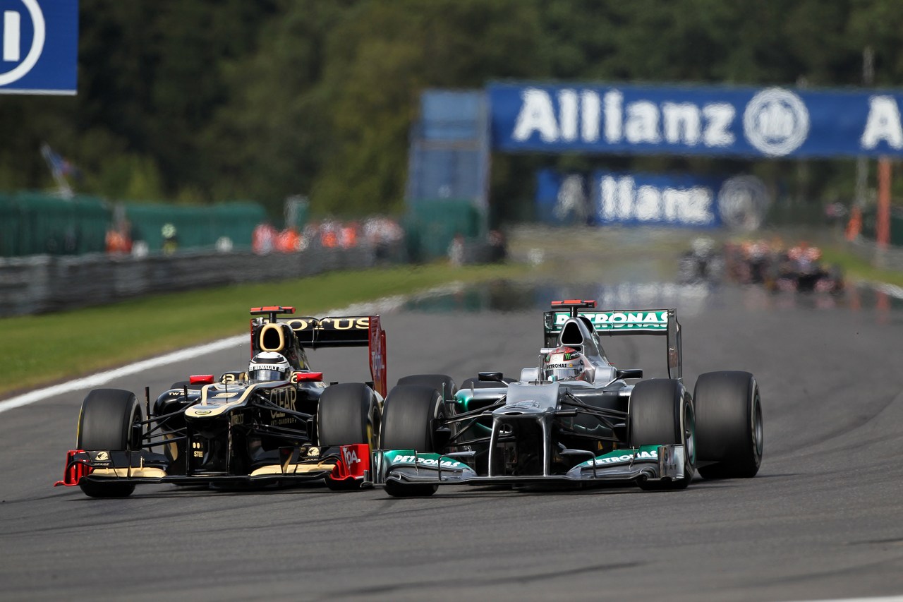 02.09.2012- Race,Kimi Raikkonen (FIN) Lotus F1 Team E20 and Michael Schumacher (GER) Mercedes AMG F1 W03 