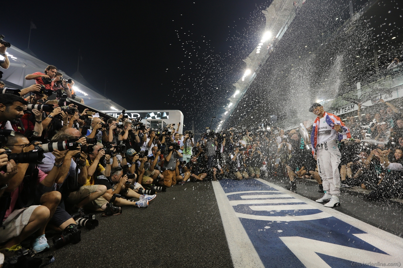 23.11.2014- Race, Celebration, Lewis Hamilton (GBR) Mercedes AMG F1 W05 F1 World Champion 2014 and 2nd position Nico Rosberg (GER) Mercedes AMG F1 W05