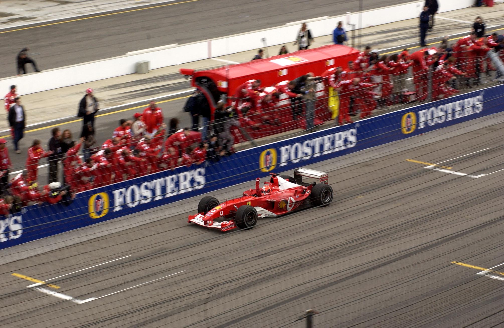 Гран при сша гонка. Шумахер 2003. Ferrari f2003 Гран при USA. Ferrari Schumacher 2003. Гран при США 2004 Шумахер.