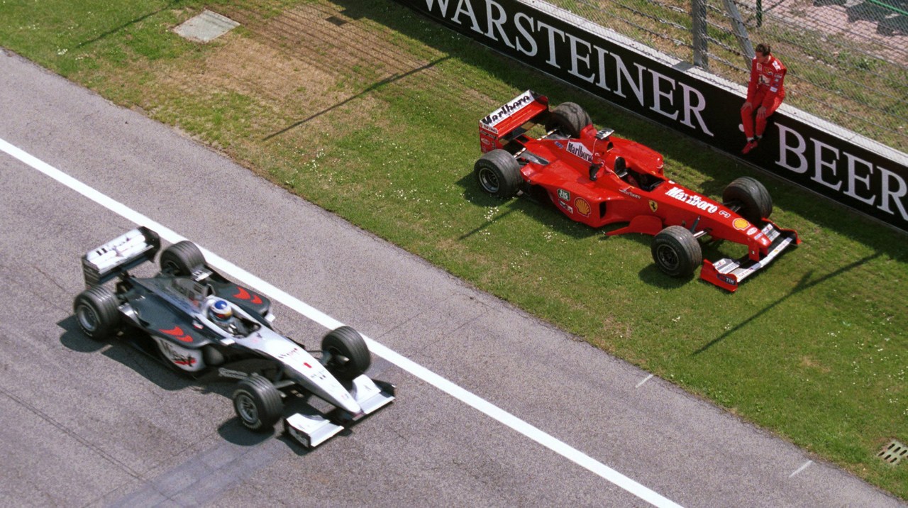 Formula One Championship 1999 - GP F1 Imola - Michae Schumacher (ger) Ferrari F399 team Ferrari F2008  watches rival Mika Hakkinen after dropping out of practice for the San Marino Grand Prix.
