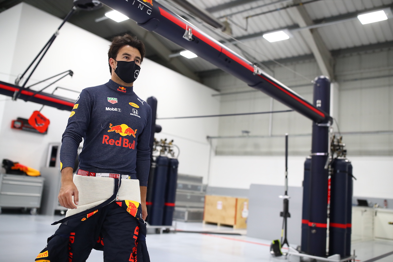 MILTON KEYNES, ENGLAND - JANUARY 12: Sergio Perez of Mexico and Red Bull Racing walks in the engineering bays at Red Bull Racing Factory on January 12, 2021 in Milton Keynes, England. (Photo by Mark Thompson/Getty Images)