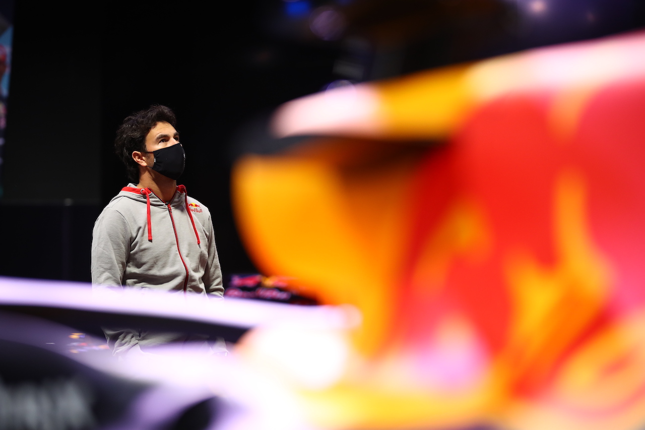 MILTON KEYNES, ENGLAND - JANUARY 11: Sergio Perez of Mexico and Red Bull Racing looks at the history of the team at MK-7 at Red Bull Racing Factory on January 11, 2021 in Milton Keynes, England. (Photo by Mark Thompson/Getty Images)