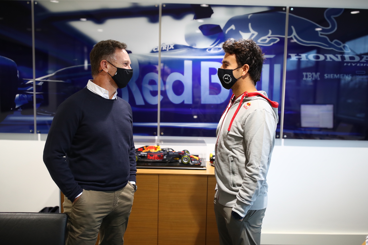 MILTON KEYNES, ENGLAND - JANUARY 11: Sergio Perez of Mexico and Red Bull Racing talks with Red Bull Racing Team Principal Christian Horner at Red Bull Racing Factory on January 11, 2021 in Milton Keynes, England. (Photo by Mark Thompson/Getty Images)