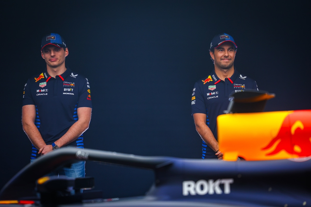 MILTON KEYNES, ENGLAND - FEBRUARY 15: Max Verstappen of the Netherlands and Oracle Red Bull Racing and Sergio Perez of Mexico and Oracle Red Bull Racing stand with the RB20 during the Oracle Red Bull Racing RB20 car launch at Red Bull Racing Factory on February 15, 2024 in Milton Keynes, England. (Photo by Mark Thompson/Getty Images for Red Bull Racing) // SI202402150753 // Usage for editorial use only // 