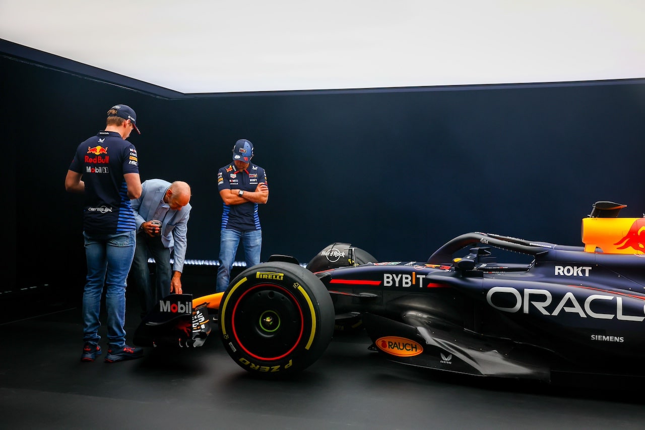 MILTON KEYNES, ENGLAND - FEBRUARY 15: Max Verstappen of the Netherlands and Oracle Red Bull Racing and Sergio Perez of Mexico and Oracle Red Bull Racing look at the RB20 with Adrian Newey, the Chief Technical Officer of Red Bull Racing during the Oracle Red Bull Racing RB20 car launch at Red Bull Racing Factory on February 15, 2024 in Milton Keynes, England. (Photo by Mark Thompson/Getty Images for Red Bull Racing) // SI202402150756 // Usage for editorial use only // 