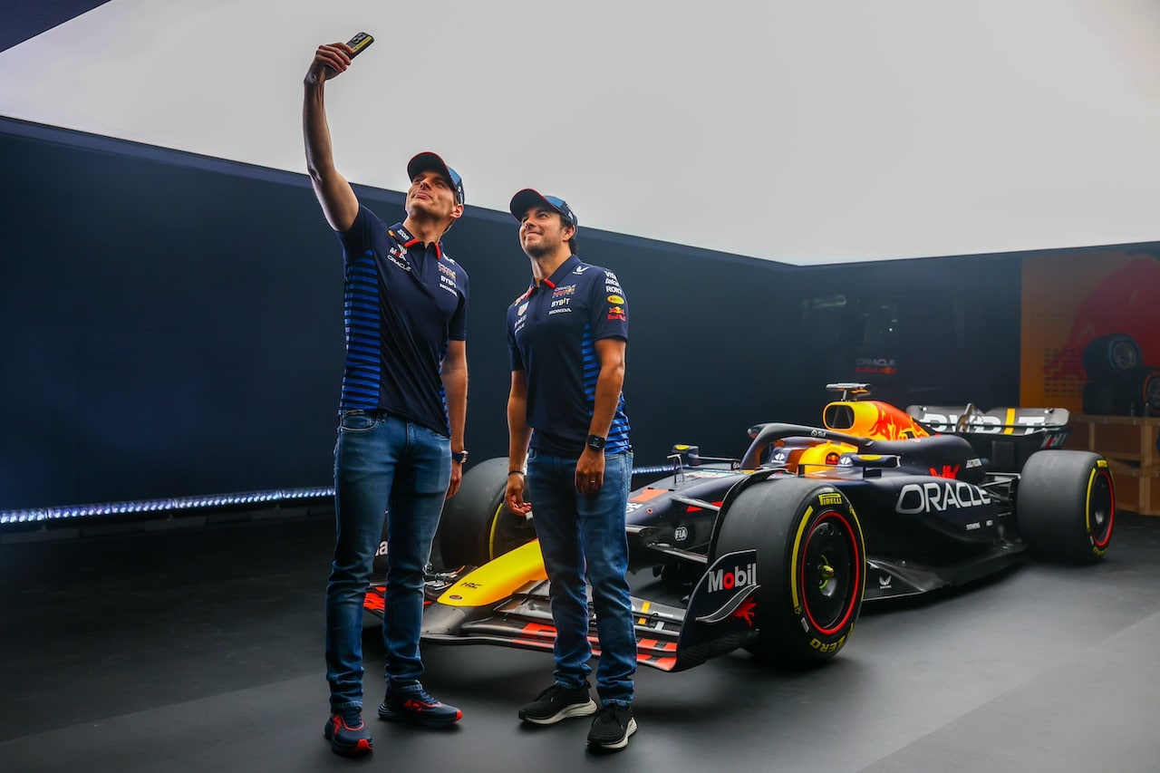 MILTON KEYNES, ENGLAND - FEBRUARY 15: Max Verstappen of the Netherlands and Oracle Red Bull Racing and Sergio Perez of Mexico and Oracle Red Bull Racing pose for a photo with the RB20 during the Oracle Red Bull Racing RB20 car launch at Red Bull Racing Factory on February 15, 2024 in Milton Keynes, England. (Photo by Mark Thompson/Getty Images for Red Bull Racing) // SI202402150761 // Usage for editorial use only // 