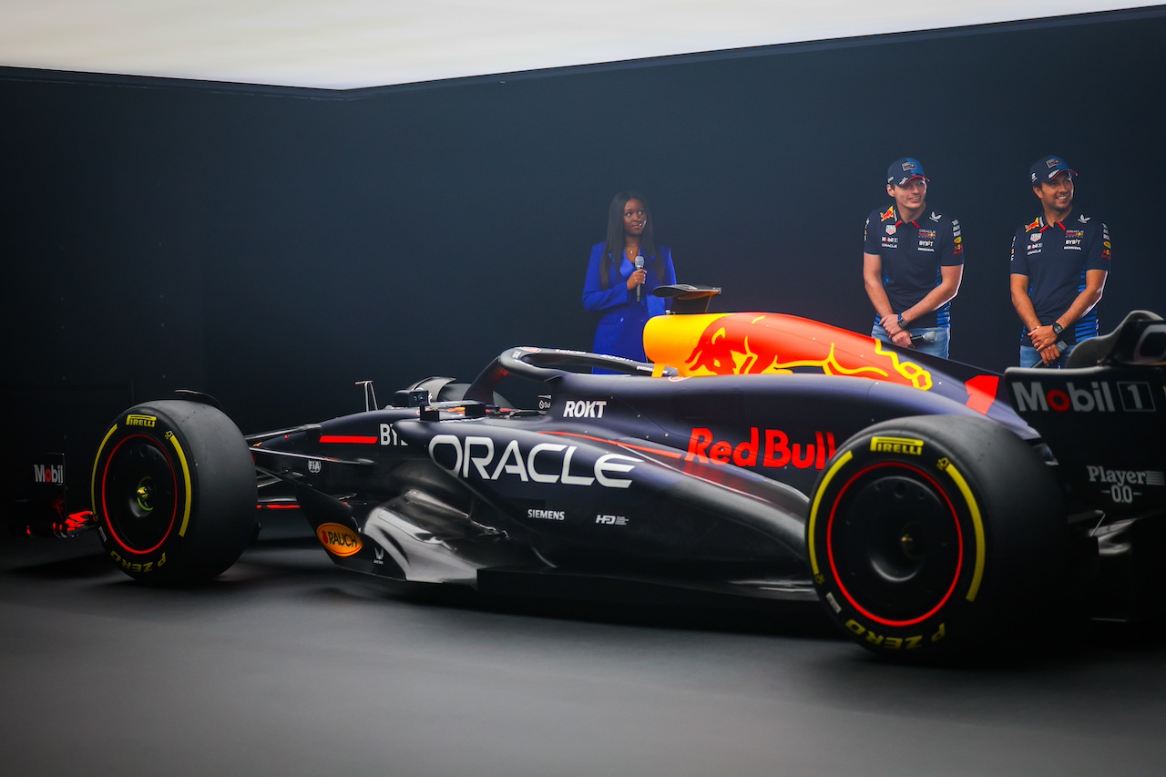 MILTON KEYNES, ENGLAND - FEBRUARY 15: Max Verstappen of the Netherlands and Oracle Red Bull Racing and Sergio Perez of Mexico and Oracle Red Bull Racing stand with the RB20 during the Oracle Red Bull Racing RB20 car launch at Red Bull Racing Factory on February 15, 2024 in Milton Keynes, England. (Photo by Mark Thompson/Getty Images for Red Bull Racing) // SI202402150754 // Usage for editorial use only // 