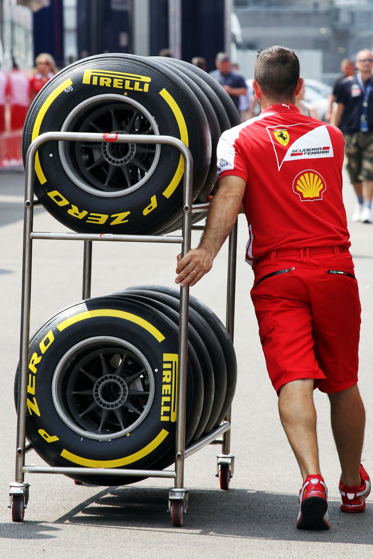 Ferrari mechanic with Pirelli tyres.

