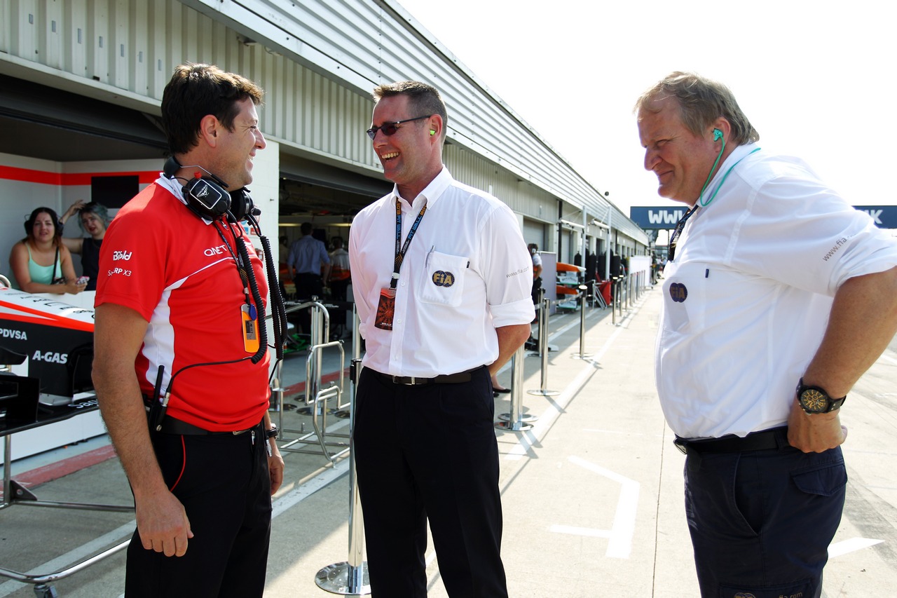 Dave O'Neill (GBR) Marussia F1 Team Manager with Jo Bauer (GER) FIA Delegate (Right).
